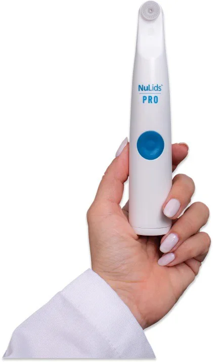 Eye Doctor Plainfield IL NuLids Device A manicured hand holding a NuLids PRO device to show it off for marketing materials