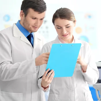 Eye Doctor Plainfield IL Surgical CoManagement BOX Two doctors consulting over results on a clipboard held between them